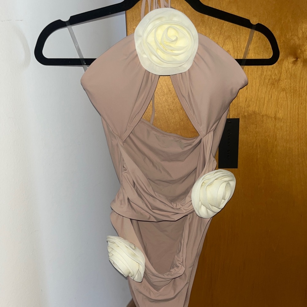 Clay colored one piece swimsuit with cut out at stomach with rose flower accents